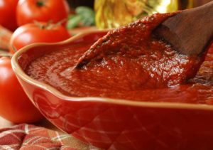 red tomato sauce with lycopene in red bowl